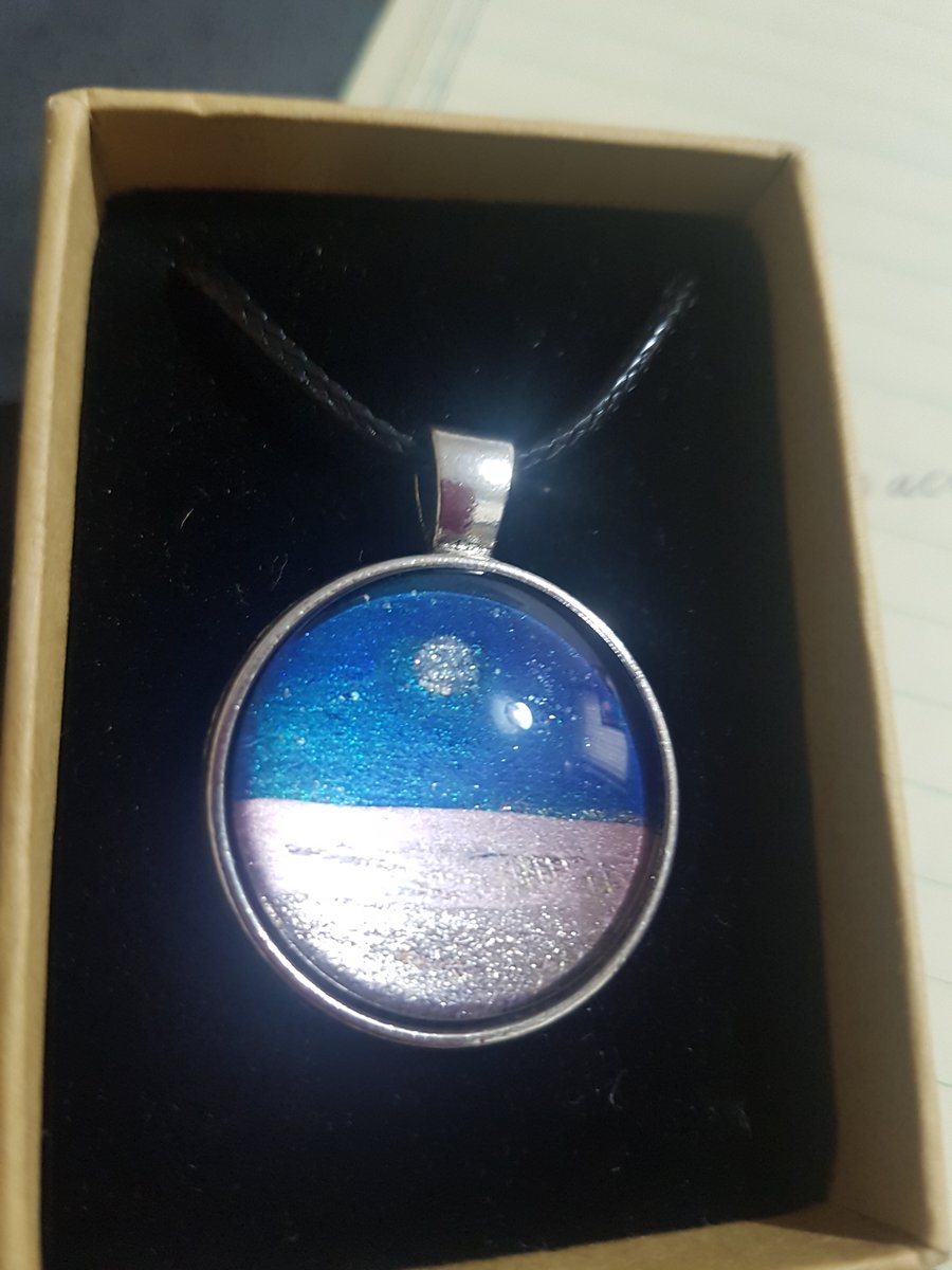 Moon in night sky pendant 