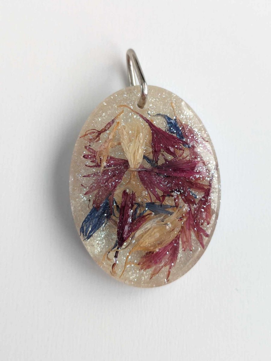 Large Resin Oval Pendant With Three Colours Of Petals