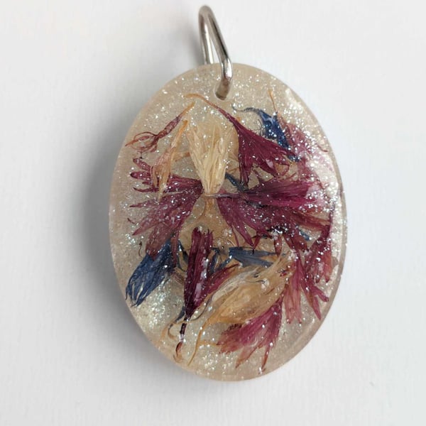 Large Resin Oval Pendant With Three Colours Of Petals