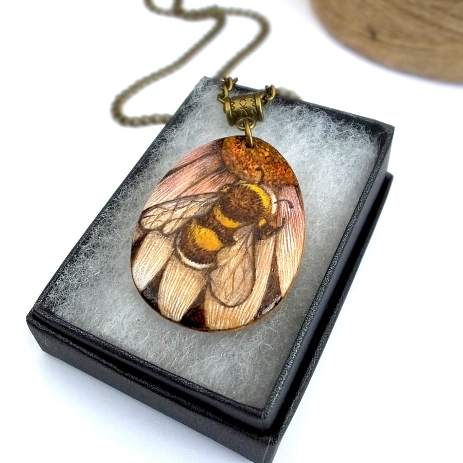Bumblebee on a flower, hand coloured, wooden pyrography teardrop pendant.