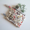 Make up bag or purse in an autumnal Liberty print with botanical drawings