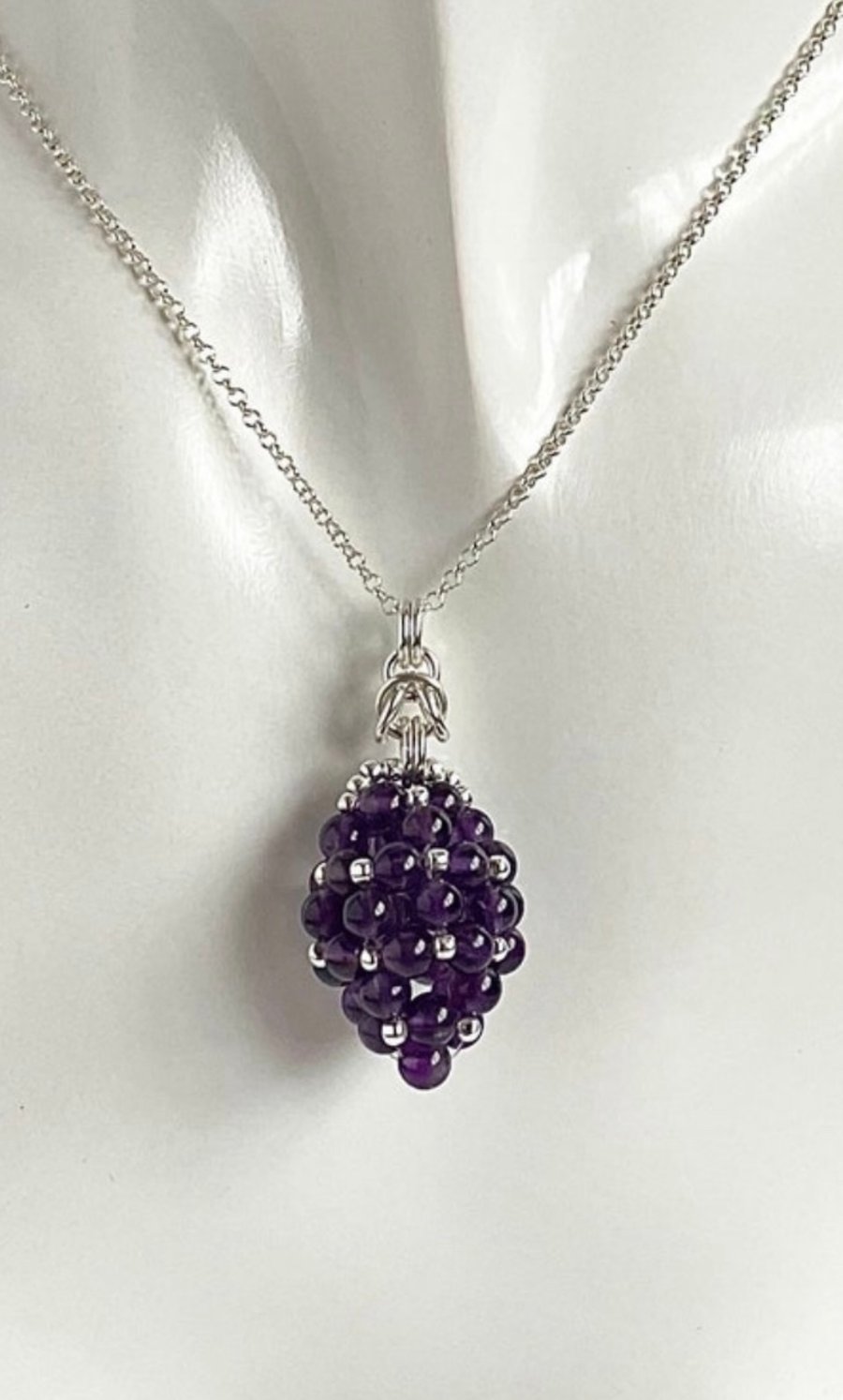 Sterling Silver Amethyst Egg Shaped Pendant, with an 18 Inch Chain