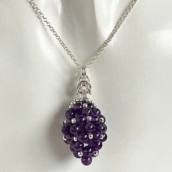 Sterling Silver Amethyst Egg Shaped Pendant, with an 18 Inch Chain