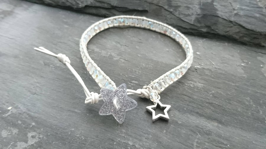 Silver and white leather and glass bead bracelet with glittery star button