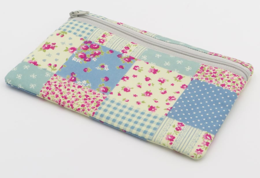 Zipped pouch for coins, storage, face masks or pencils.