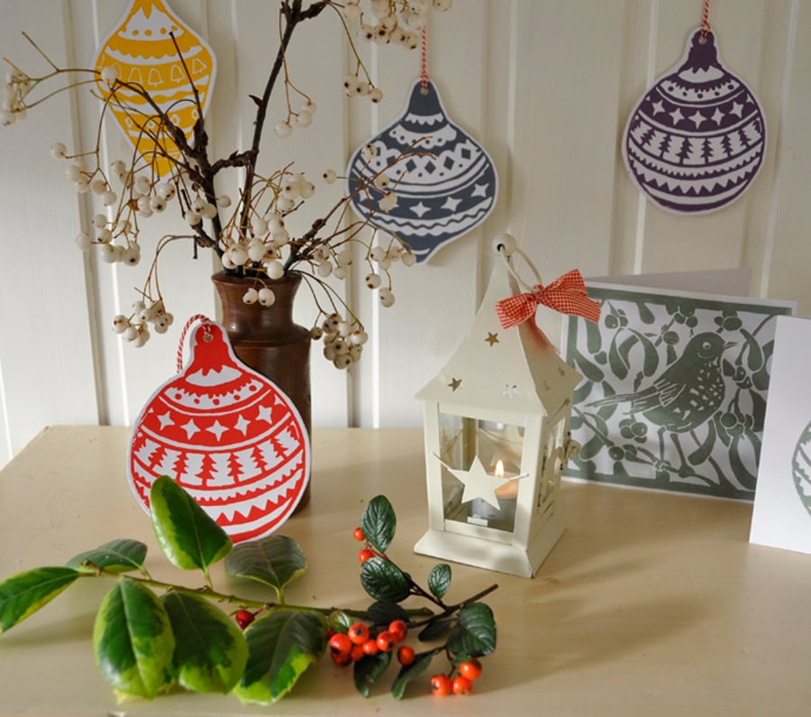 Two hand printed bauble Christmas cards or decorations.
