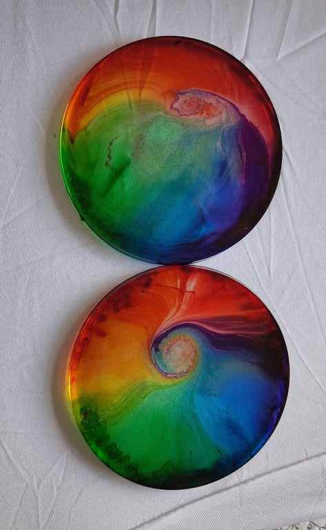 Set of two handmade epoxy resin round coasters. Rainbow swirl