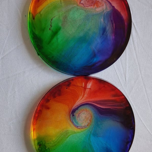 Set of two handmade epoxy resin round coasters. Rainbow swirl