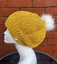 Chunky slouchy mustard beanie with white fur pompom, crochet bobble hat