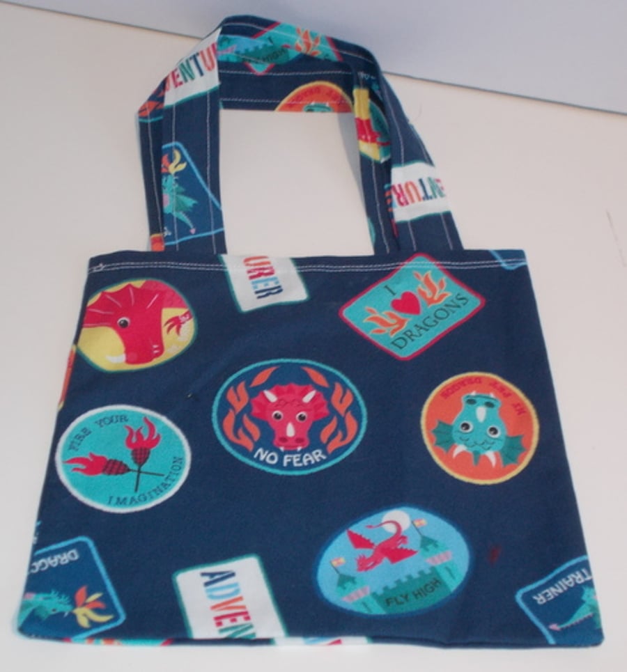 Mini tote bag for with a print badges with dragons and castles