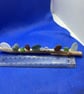 Frosted sea glass 'nuggets' on driftwood.
