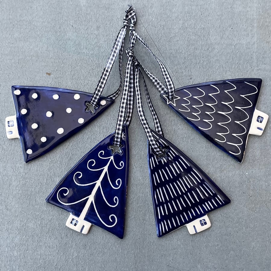 Set of four ceramic Christmas tree decorations 