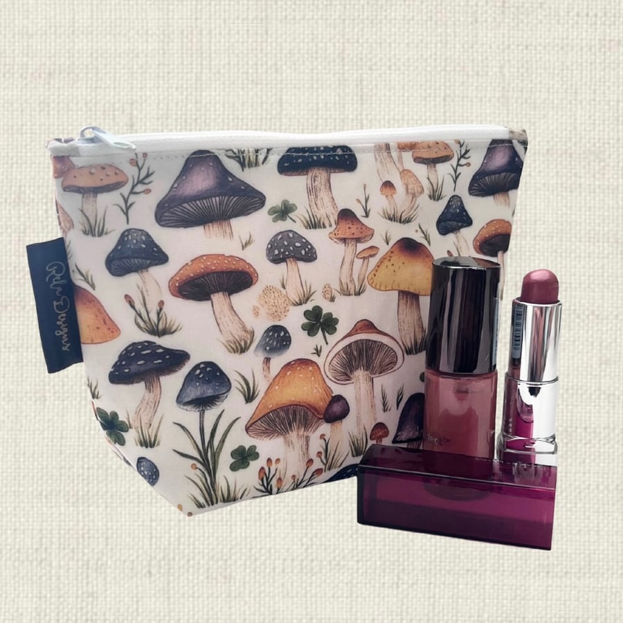Cosmetic bags mushrooms and clover.