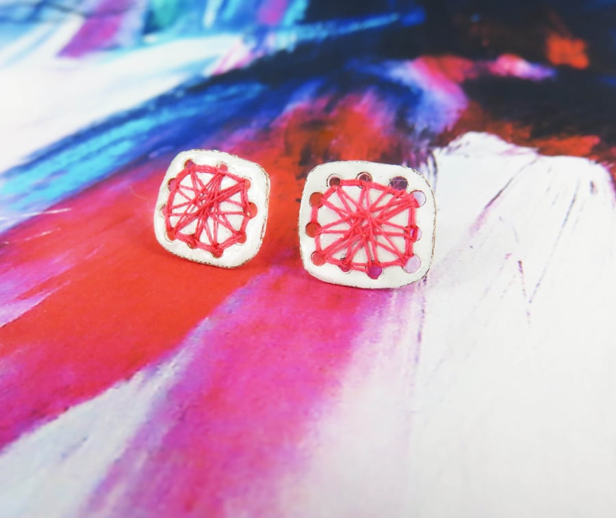 Square enamel studs with hand sewn pink thread detail