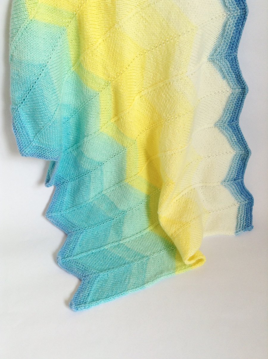 Blue and yellow hand-knitted baby blanket