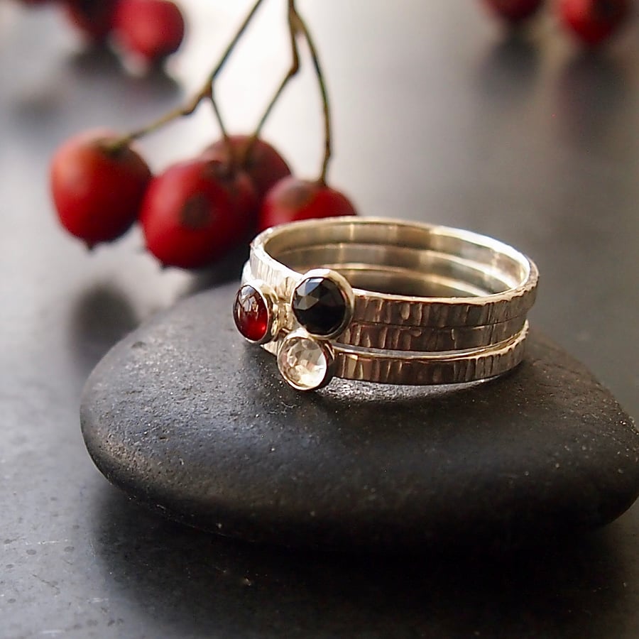  Trio of Rings in Sterling Silver with Garnet and Topaz