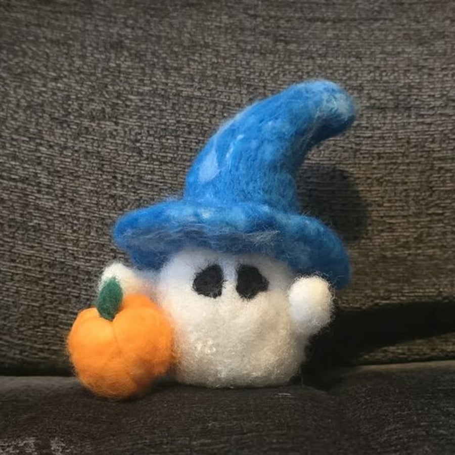 Image of Friendly Halloween Ghost with cute blue hat and his pumpkin.