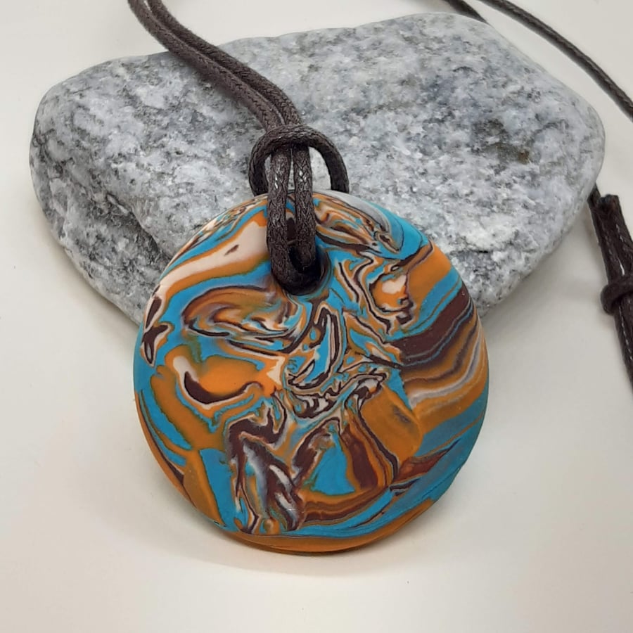 Turquoise, brown and orange round pendant