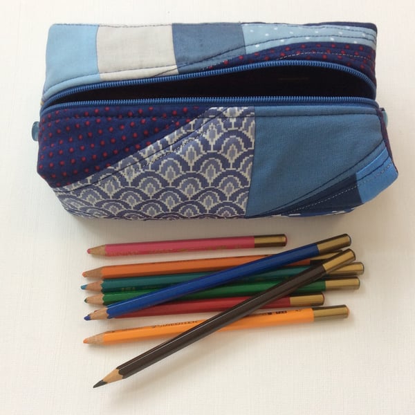 Boxy, zipped make up bag, pencil case.