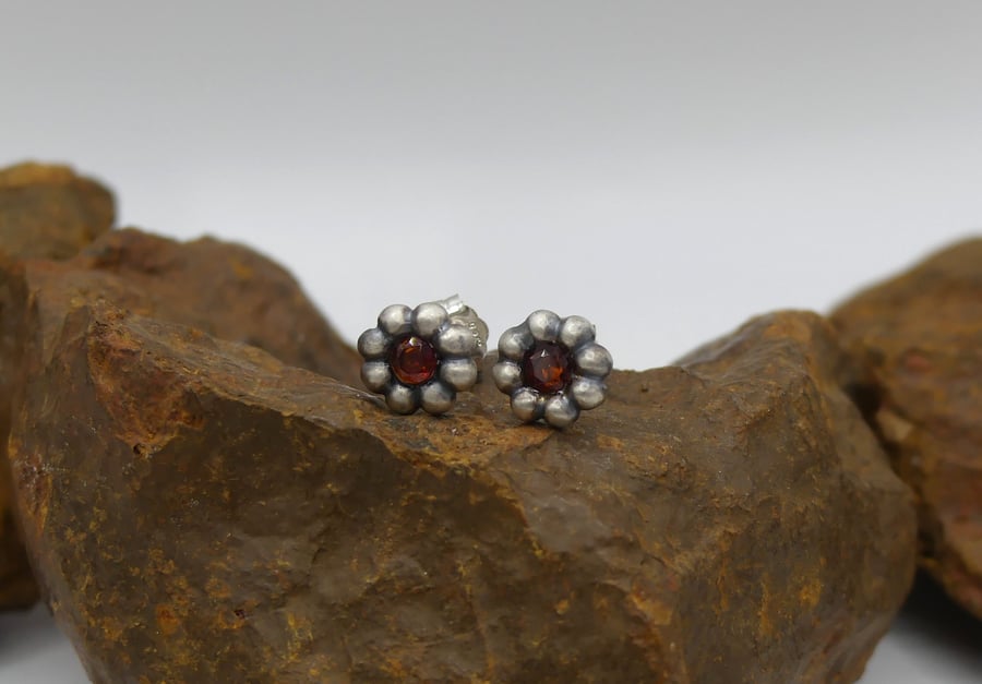 Recycled Sterling Silver Flower Stud Earrings with 3mm Garnet Gemstones.