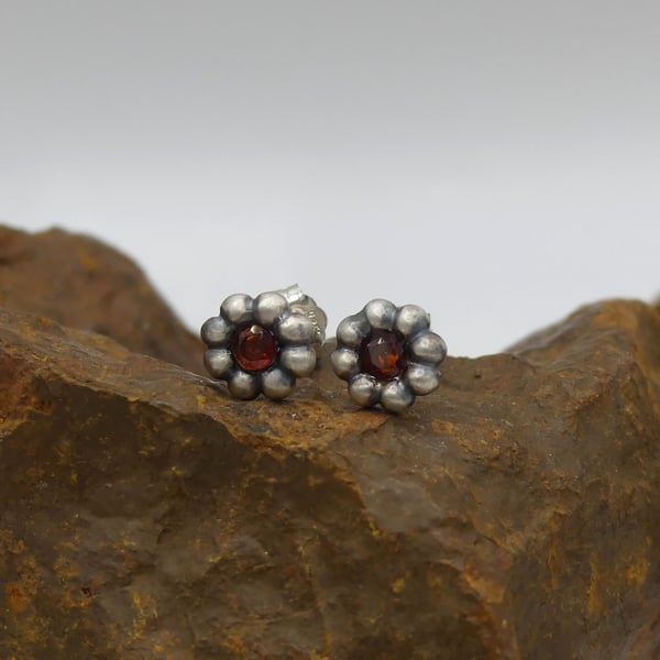 Recycled Sterling Silver Flower Stud Earrings with 3mm Garnet Gemstones.