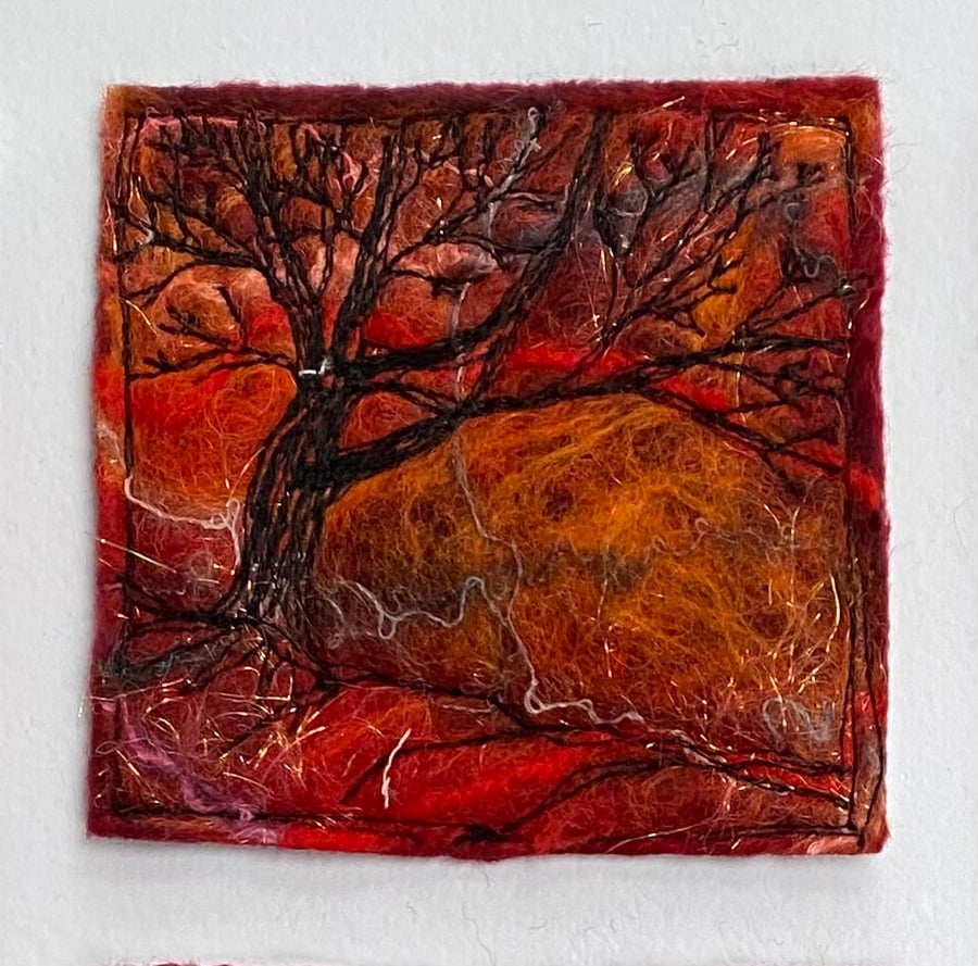 Tree silhouette with sunrise, original wet felting artwork.