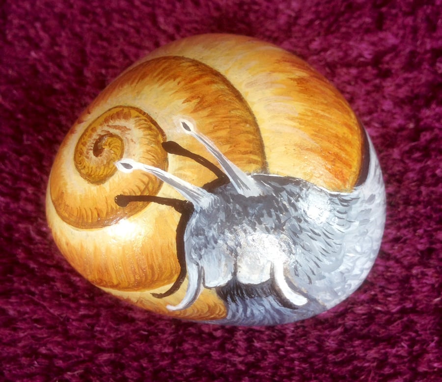 Hand painted garden snail on rock