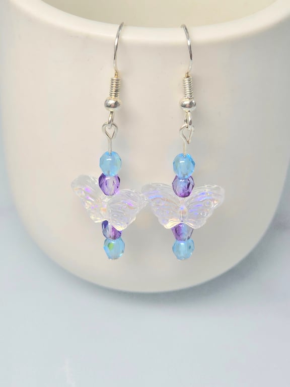 Clear glass beaded buterfly earrings with purple and blue beads 