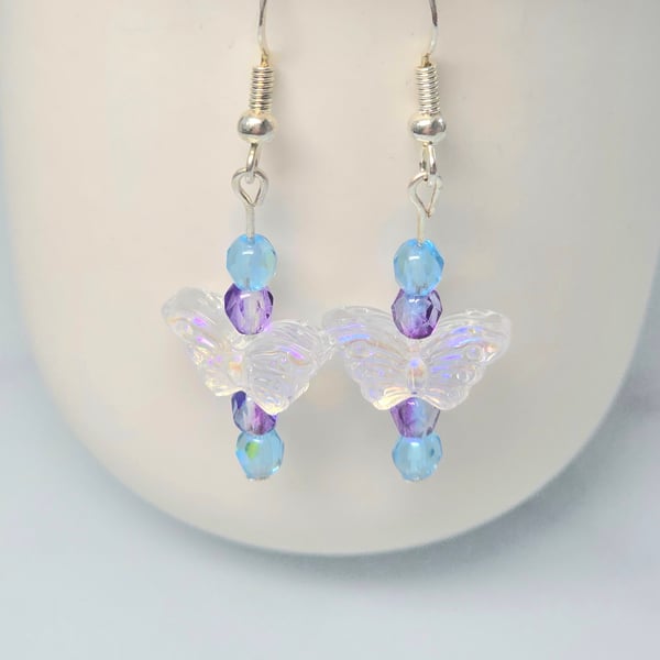 Clear glass beaded buterfly earrings with purple and blue beads 