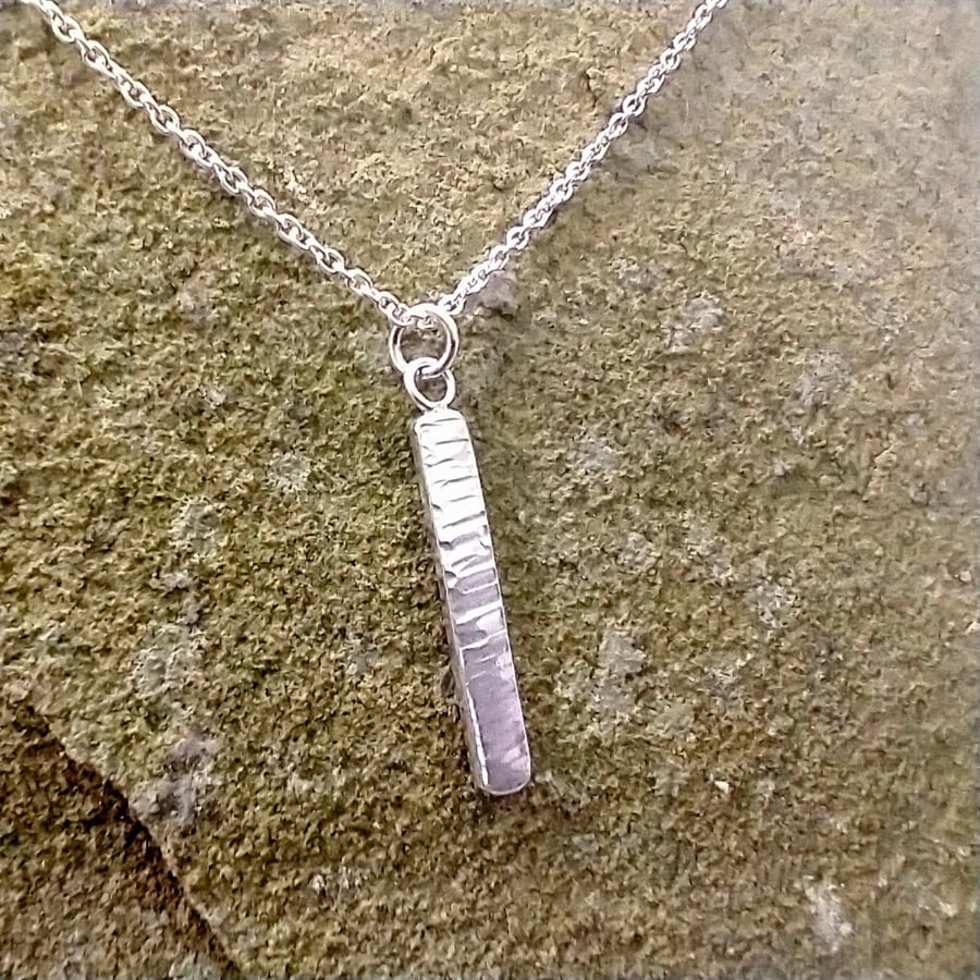 Silver bar pendant with textured finish 