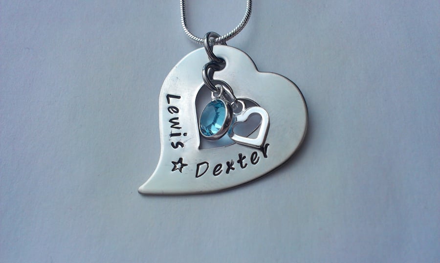 Hand stamped tilted heart washer necklace with sterling silver charm