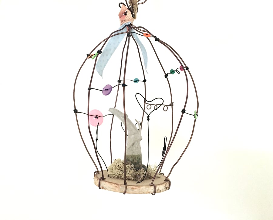 Creature in wire bird cage, wire art sculpture, wire and pottery hanger, fantasy