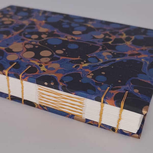 Handcrafted A6 coptic stitch notebook with recycled paper