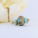 Soft Green Lampwork Glass Pendant Necklace on 18" Gold Tone Chain