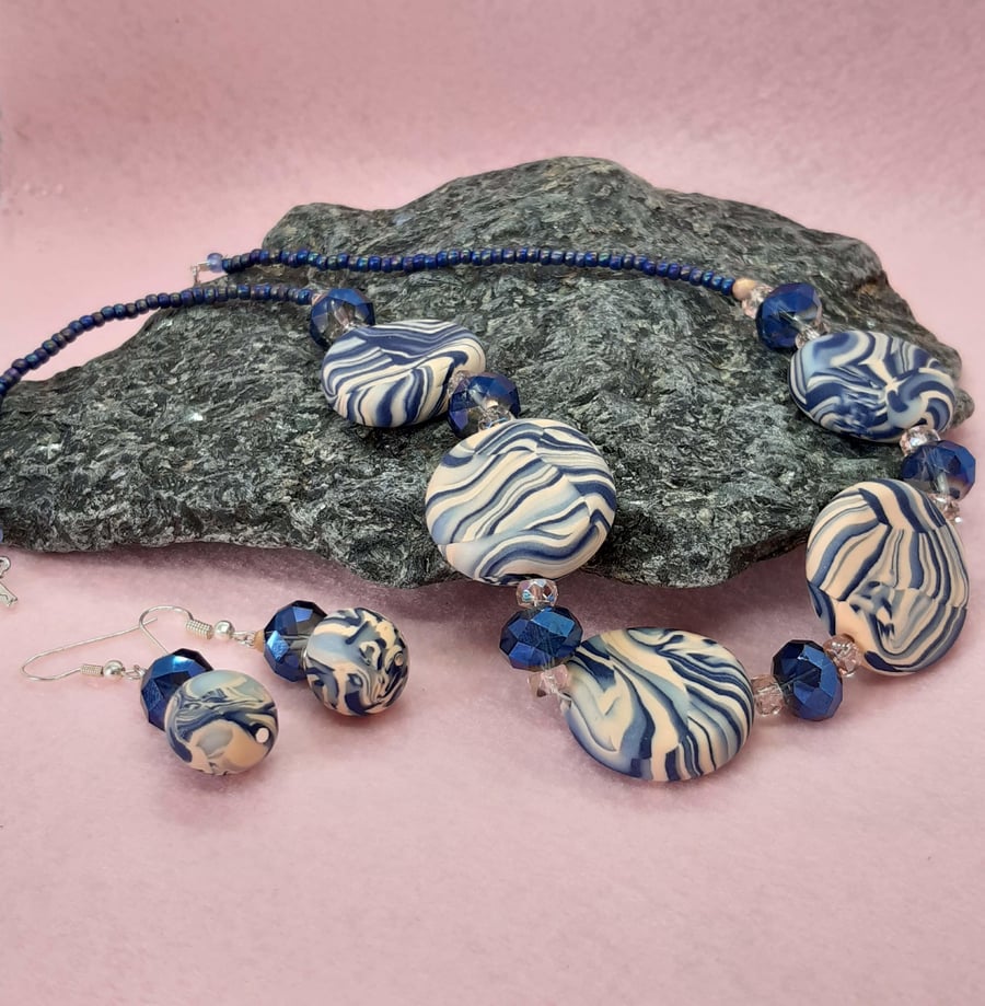 Dusky pink and navy polymer clay disc-shaped necklace and earring set
