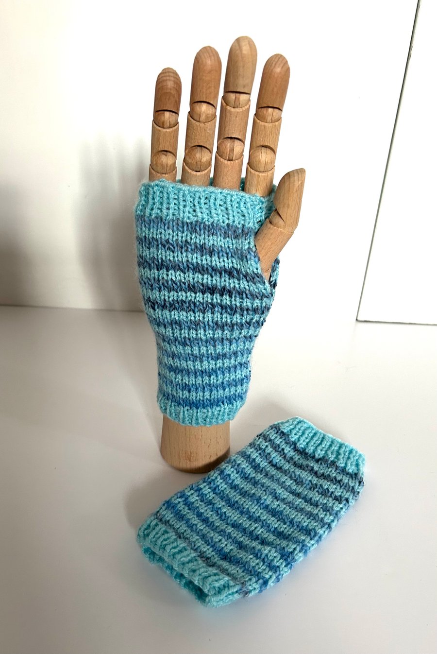 Hand knitted blue stripy wrist warmers