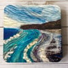 Seascape coaster or drinks mat. 