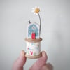 Wooden House on a Vintage Floral Bobbin with Clay Daisy