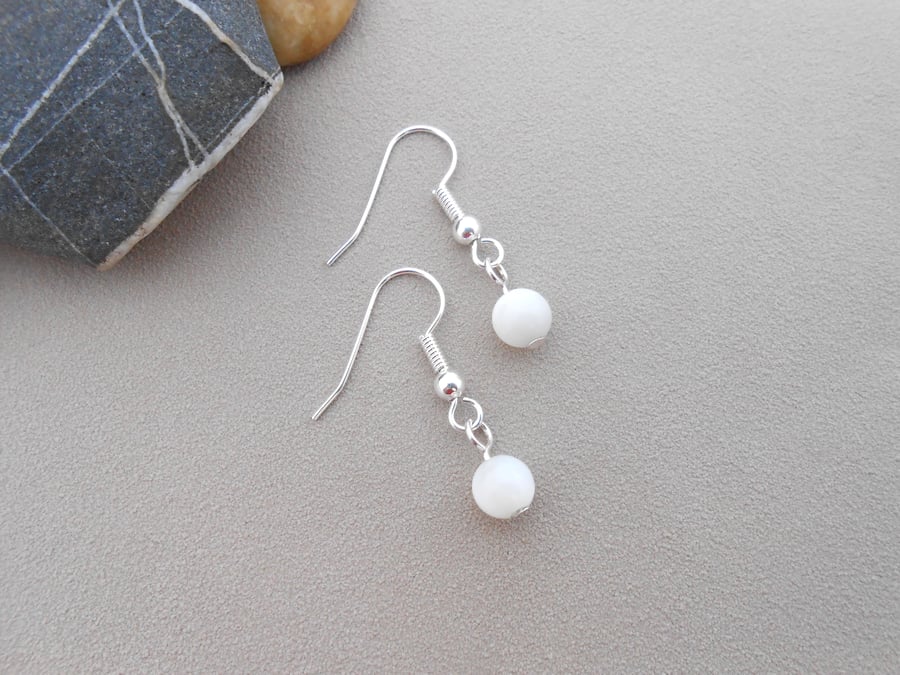 Simple mother of pearl 1" drop earrings.