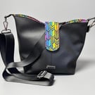 Classic black bucket bag with vibrant inside