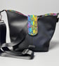 Classic black bucket bag with vibrant inside