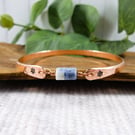 Bangle, Copper and Sodalite Bracelet with Stamped Flowers. Size 21cms