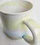 A handmade stoneware mug in yellow, green and oatmeal - Image 5