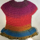 Multicoloured dress with double frill, crocheted by hand.