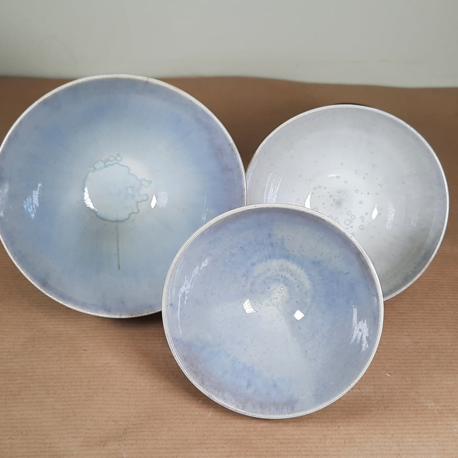 A set of three small wheel thrown ceramic nesting bowls