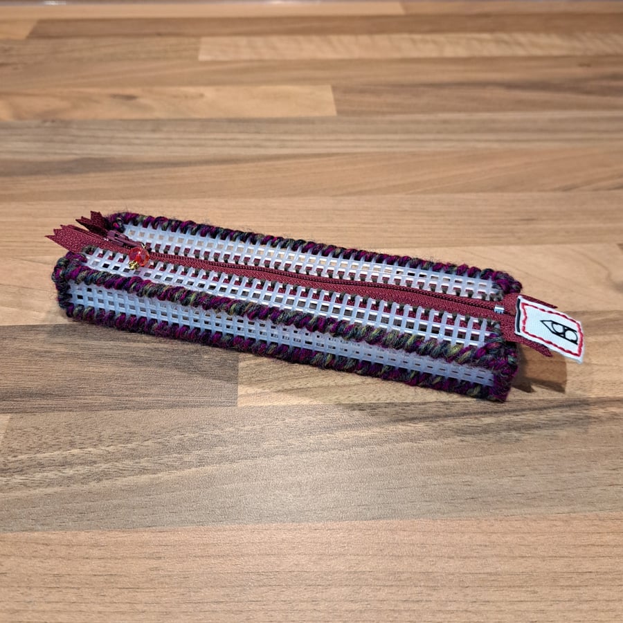 Pencil case - see-through with pink and green edge, maroon zip, red charm