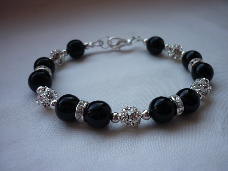 BLACK AND SILVER PLATED RHINESTONE BALL BRACELET.  371