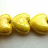 3 yellow ceramic heart beads