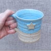 Coffee mug tea cup with a star in stoneware hand thrown pottery ceramic 