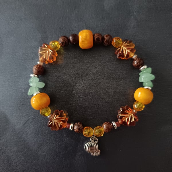 Elasticated Autumnal beaded bracelet with silver pumpkin charm 
